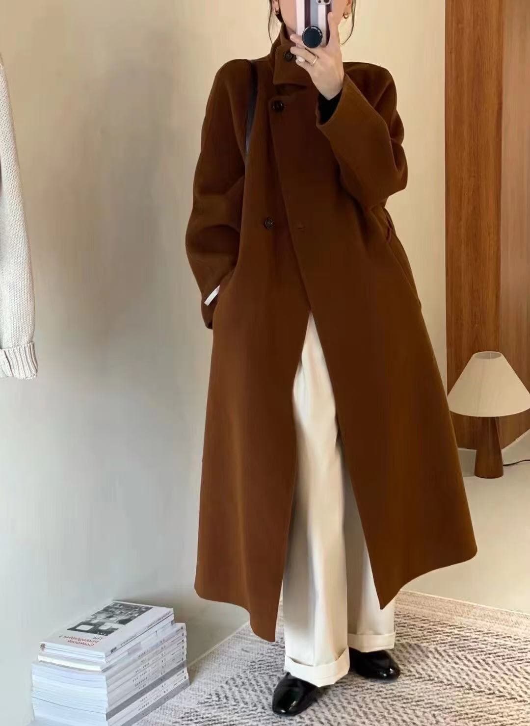 Camel coat sample in a studio mirror shot
