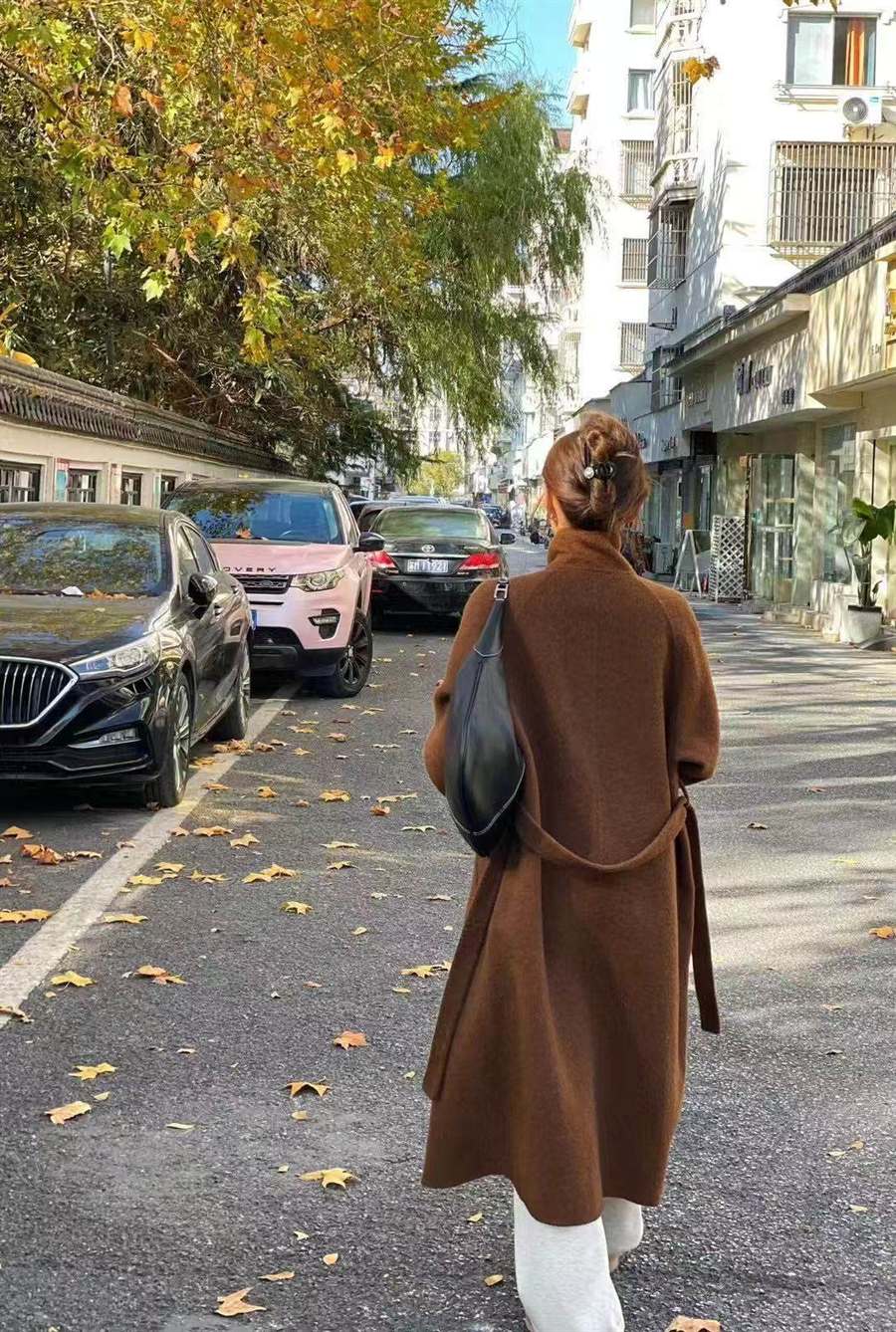 Back view of a chocolate full-length cashmere coat